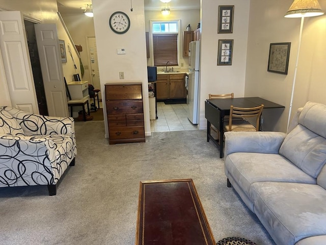 living room with light carpet and light tile patterned flooring