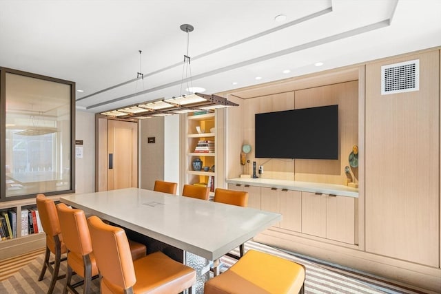 dining room with recessed lighting and visible vents