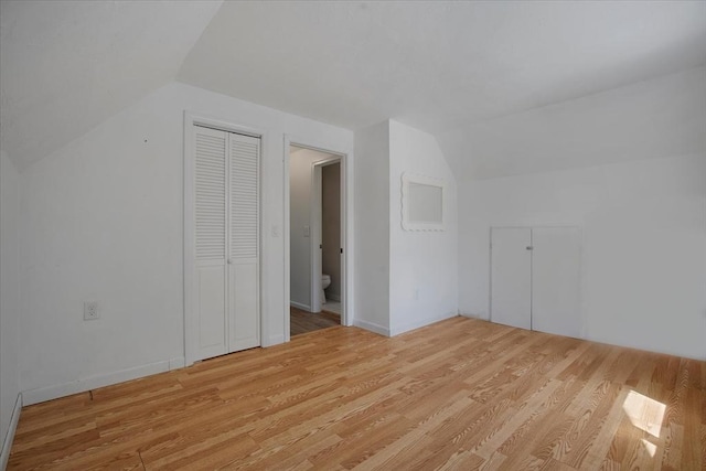 42 Beechwood Dr, Mashpee, MA 02649 - additional living space with lofted ceiling and light wood-style floors