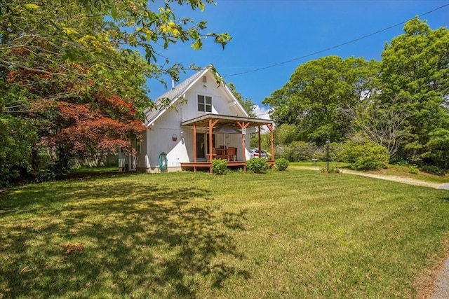 42 Beechwood Dr, Mashpee, MA 02649 - back of property with a yard