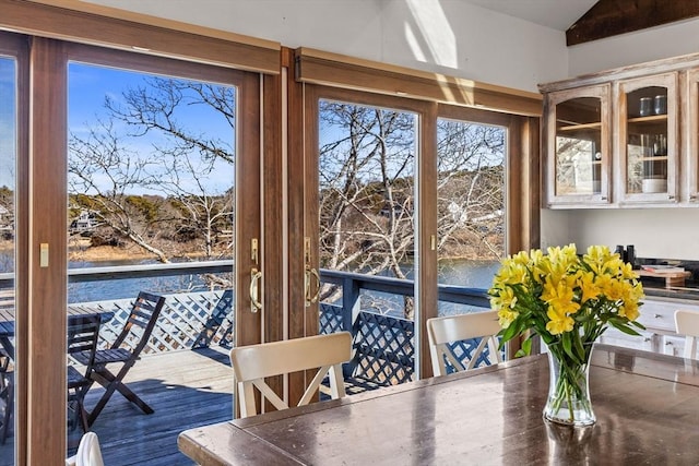 dining space with lofted ceiling