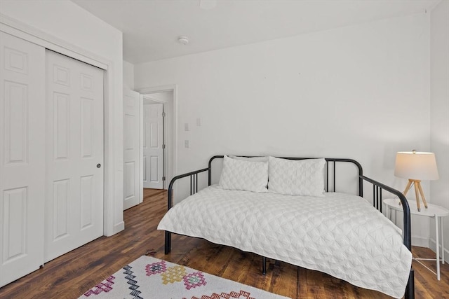 bedroom featuring a closet and wood finished floors