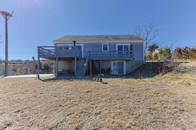 rear view of house with a deck and stairs