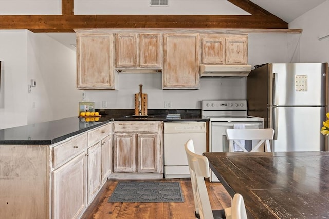 kitchen featuring dark wood finished floors, dark countertops, lofted ceiling with beams, white appliances, and under cabinet range hood