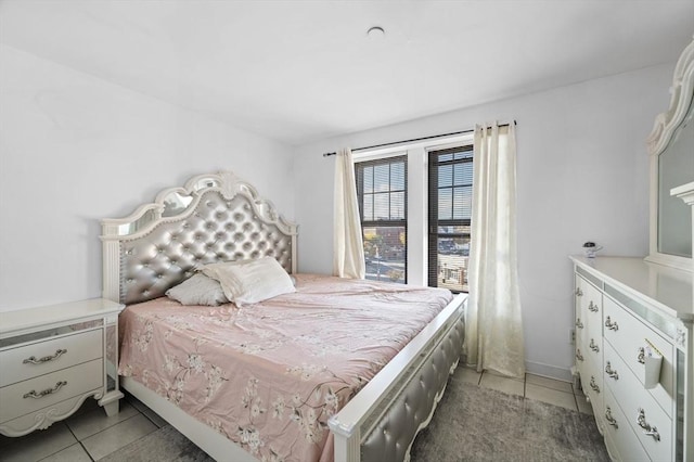 bedroom featuring dark tile patterned floors