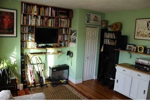 living room with dark hardwood / wood-style flooring