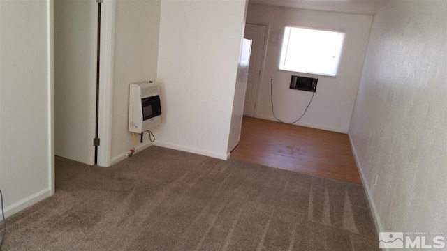spare room with dark carpet