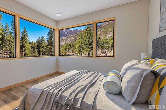 bedroom with light wood-type flooring