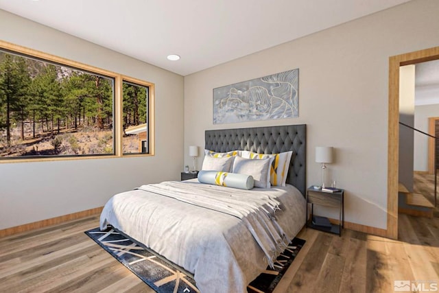 bedroom with light wood-type flooring