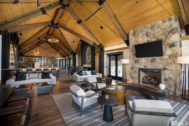 interior space featuring dark hardwood / wood-style floors, wooden ceiling, high vaulted ceiling, beam ceiling, and a stone fireplace