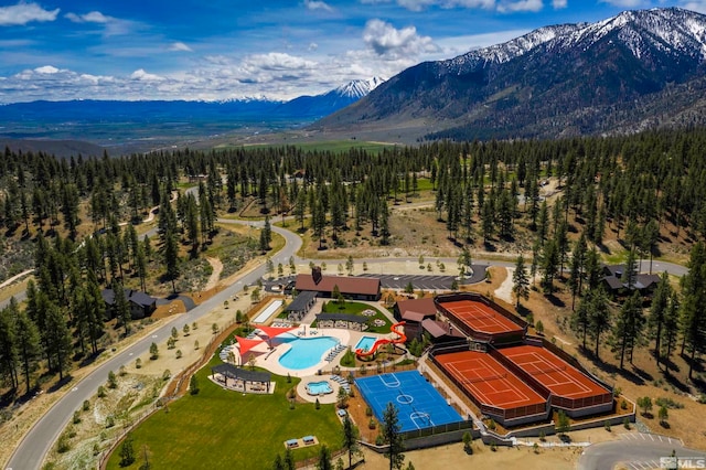 birds eye view of property with a mountain view