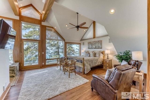 bedroom featuring high vaulted ceiling, beamed ceiling, access to exterior, and hardwood / wood-style flooring