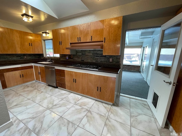 kitchen featuring stainless steel dishwasher, light tile floors, black gas cooktop, backsplash, and sink