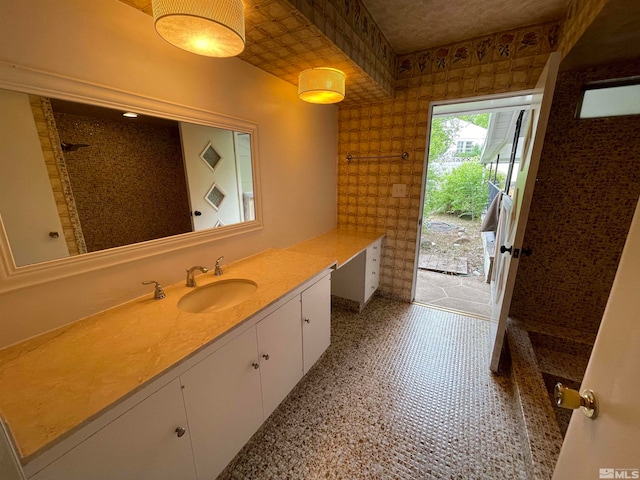 bathroom featuring tile flooring and vanity