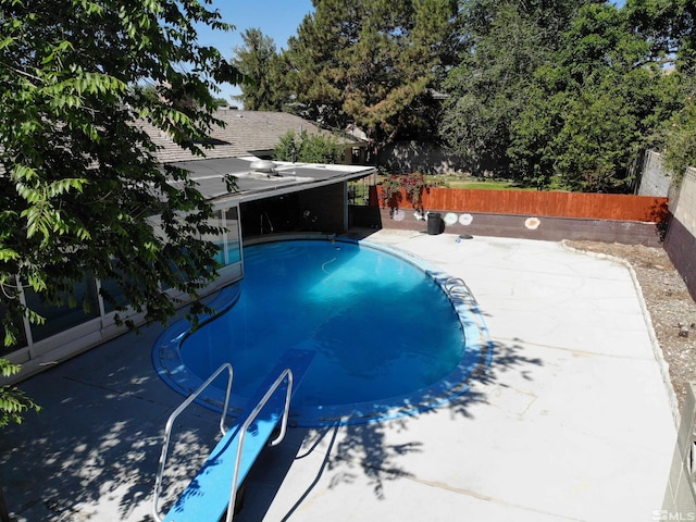 view of pool featuring a patio