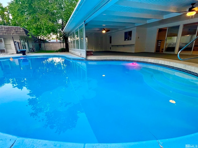 view of swimming pool with a patio area and ceiling fan