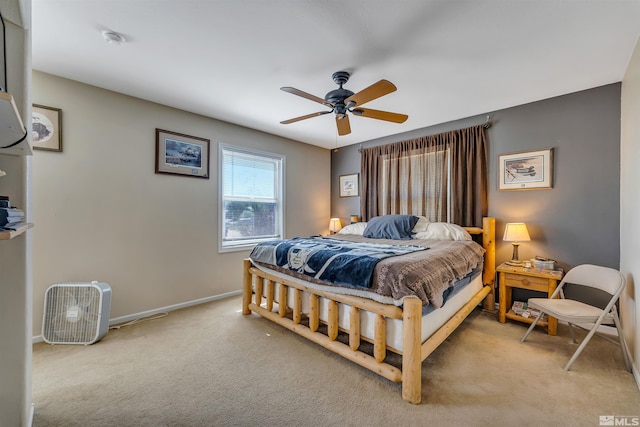 bedroom featuring ceiling fan and light colored carpet