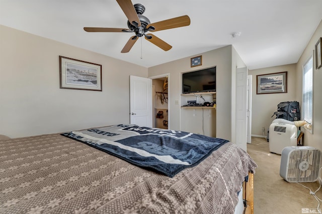 bedroom with light colored carpet, a closet, and ceiling fan