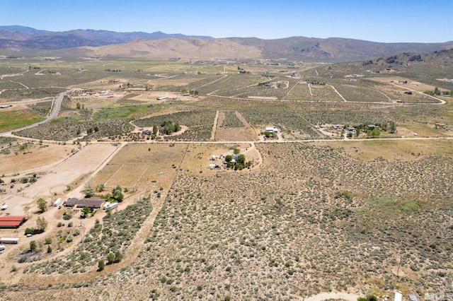 birds eye view of property featuring a mountain view and a rural view