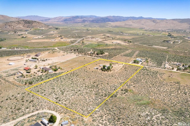 drone / aerial view with a mountain view and a rural view