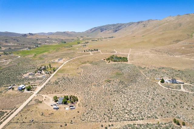 birds eye view of property featuring a rural view and a mountain view