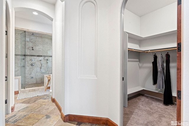 spacious closet with light tile floors