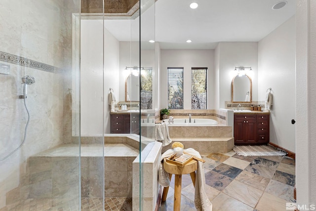 bathroom with oversized vanity, tile flooring, and plus walk in shower