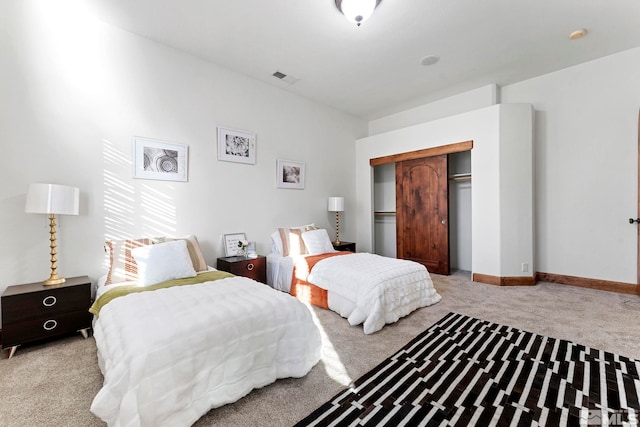 carpeted bedroom with a closet