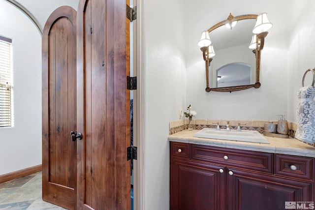 bathroom featuring tile floors and vanity