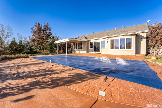 view of swimming pool featuring a patio area