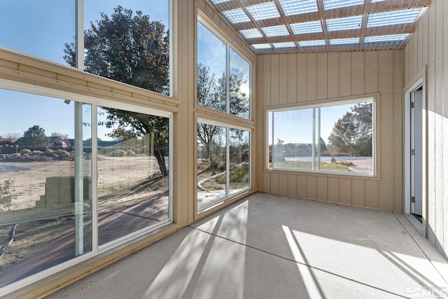 unfurnished sunroom featuring lofted ceiling