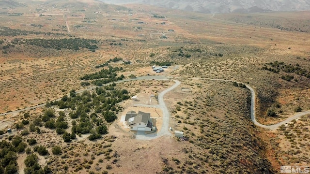 birds eye view of property with a rural view