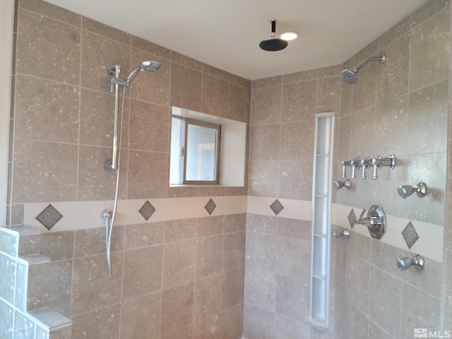 bathroom with tiled shower