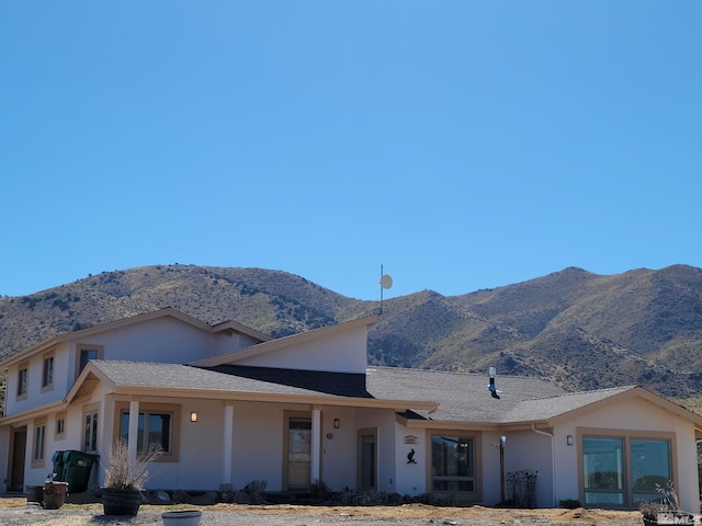 view of front of home featuring a mountain view