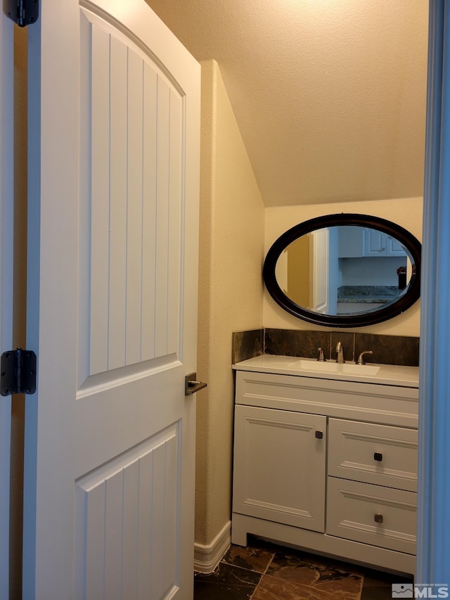 bathroom featuring tile floors and vanity