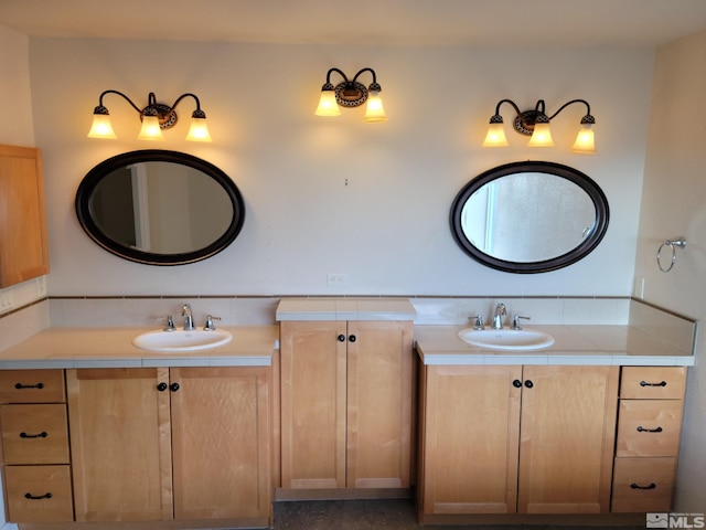 bathroom featuring dual vanity