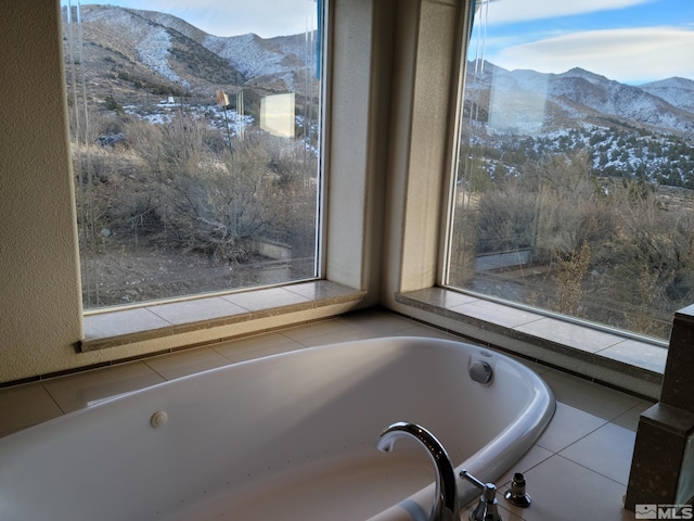 bathroom featuring a mountain view and plenty of natural light