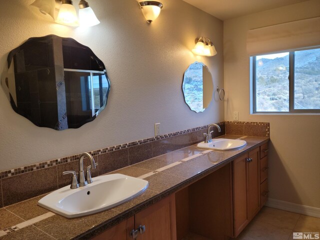 bathroom featuring tile floors and double sink vanity