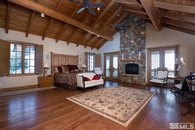 living room featuring high vaulted ceiling, beam ceiling, ceiling fan, wood ceiling, and a stone fireplace