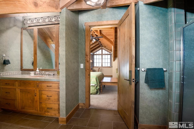 bathroom with vanity, tile flooring, backsplash, and vaulted ceiling