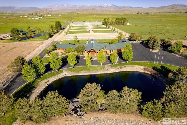 drone / aerial view featuring a rural view and a mountain view