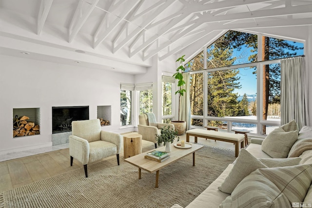 sunroom with lofted ceiling with beams