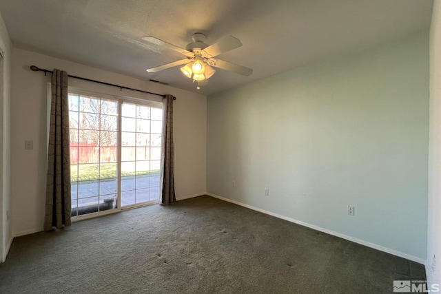 carpeted empty room featuring ceiling fan