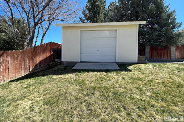 garage featuring a yard