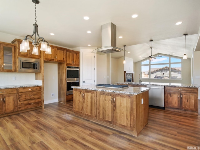 kitchen featuring dark hardwood / wood-style floors, a kitchen island, appliances with stainless steel finishes, and island exhaust hood