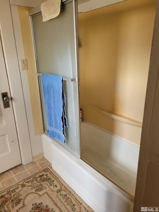 bathroom featuring  shower combination and tile flooring