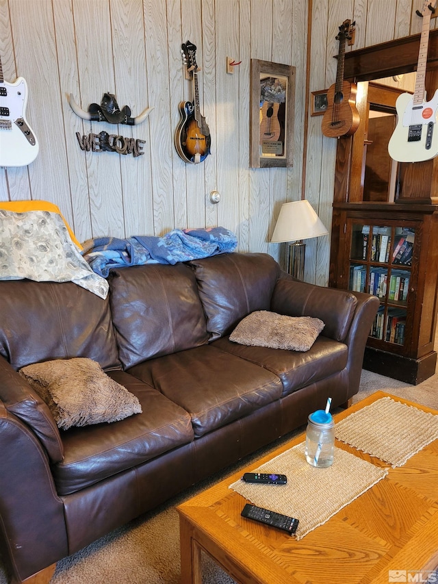 living room featuring wood walls