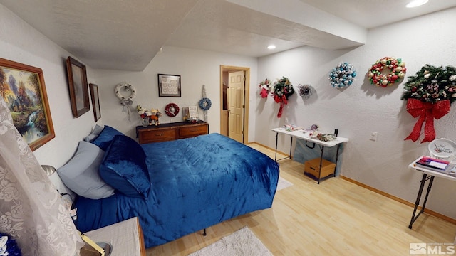 bedroom featuring light wood-type flooring