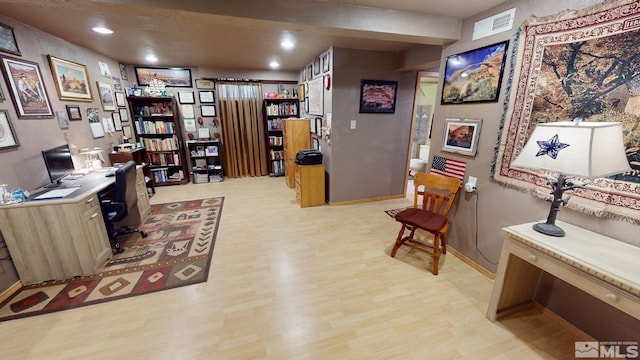 office space with light hardwood / wood-style floors