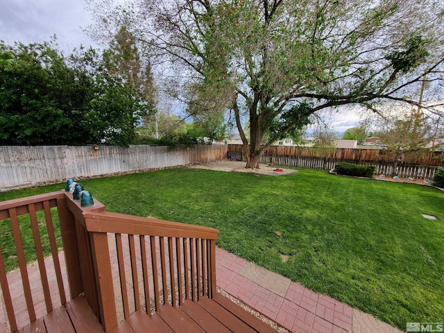 wooden deck with a lawn